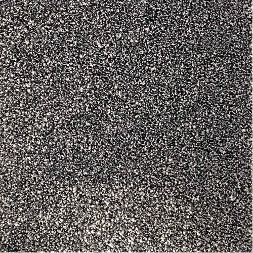 A close-up texture shot of a black and white speckled carpet | Carpetly 